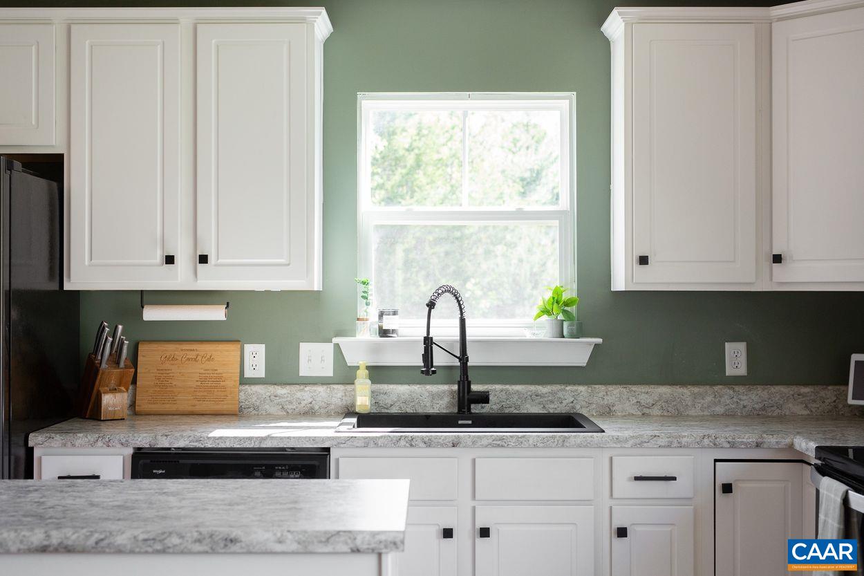 1090 Briery Farm Road Scottsville, VA 24590 - Photo 8 of 30 a kitchen with granite countertop white cabinets and a sink
