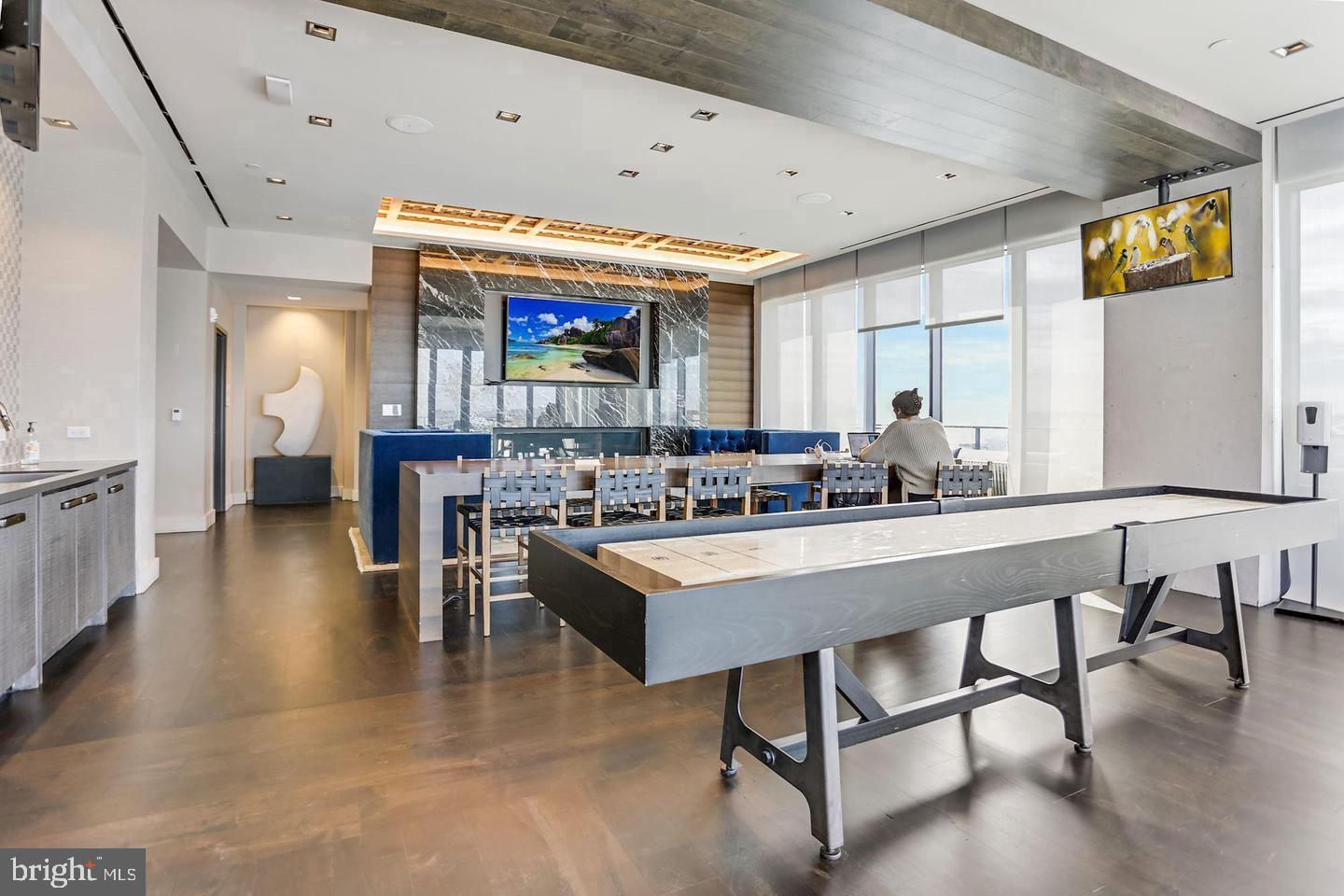 70 N Street Southeast, Unit 511 Washington, DC 20003 - Photo 17 of 22 a living room with stainless steel appliances kitchen island granite countertop furniture and a large window