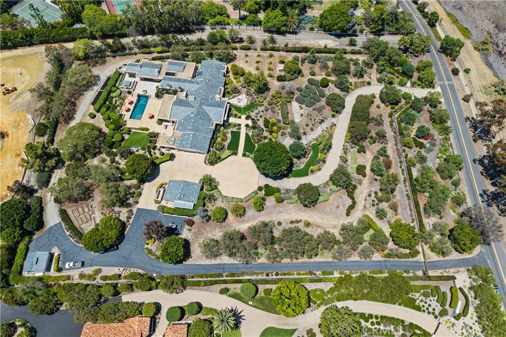 6533 Lago Lindo Rancho Santa Fe, CA 92067 - Photo 5 of 57 an aerial view of a house with a yard and garden