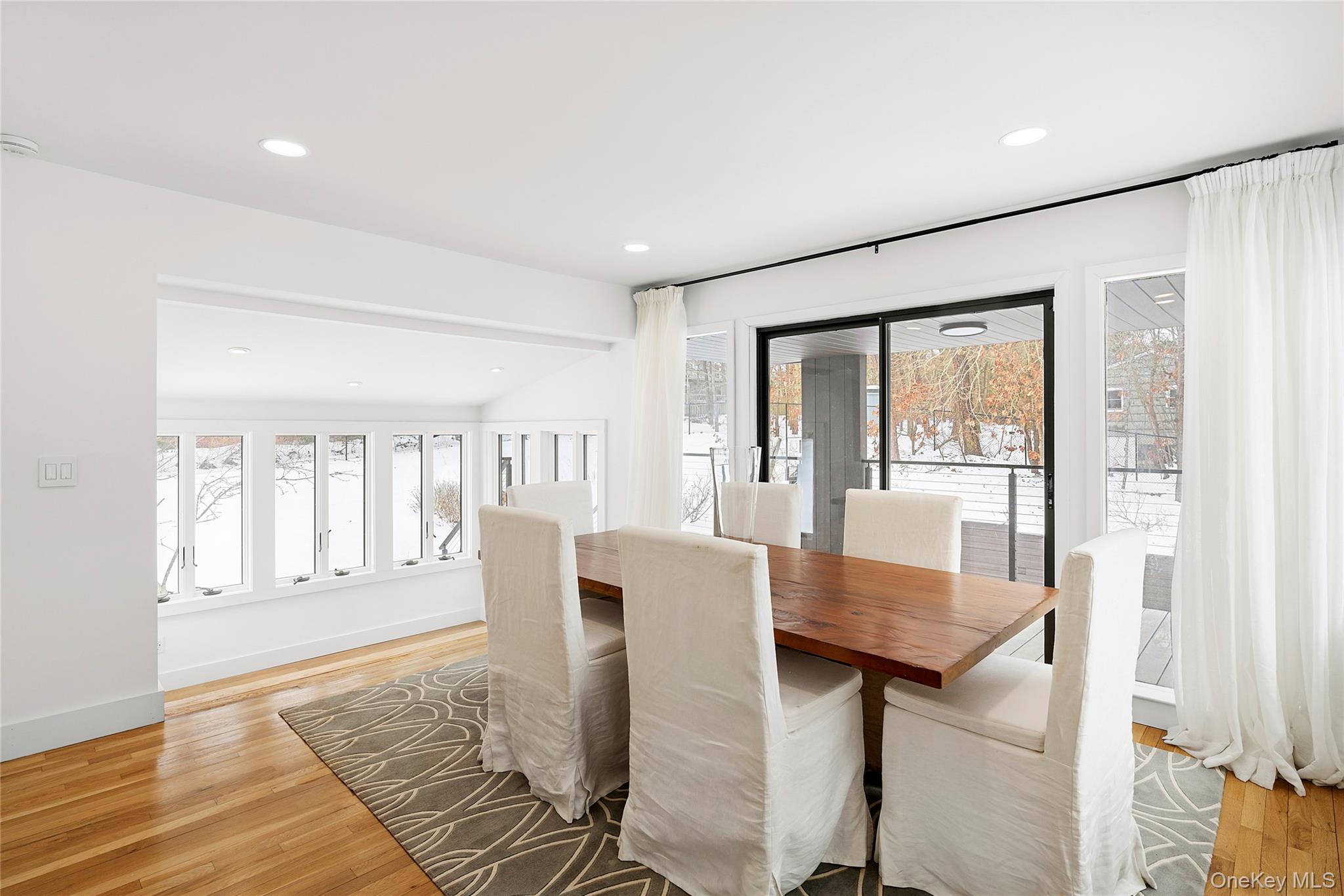 138 Longview Road Southampton, NY 11968 - Photo 3 of 13 a dining room with furniture and wooden floor