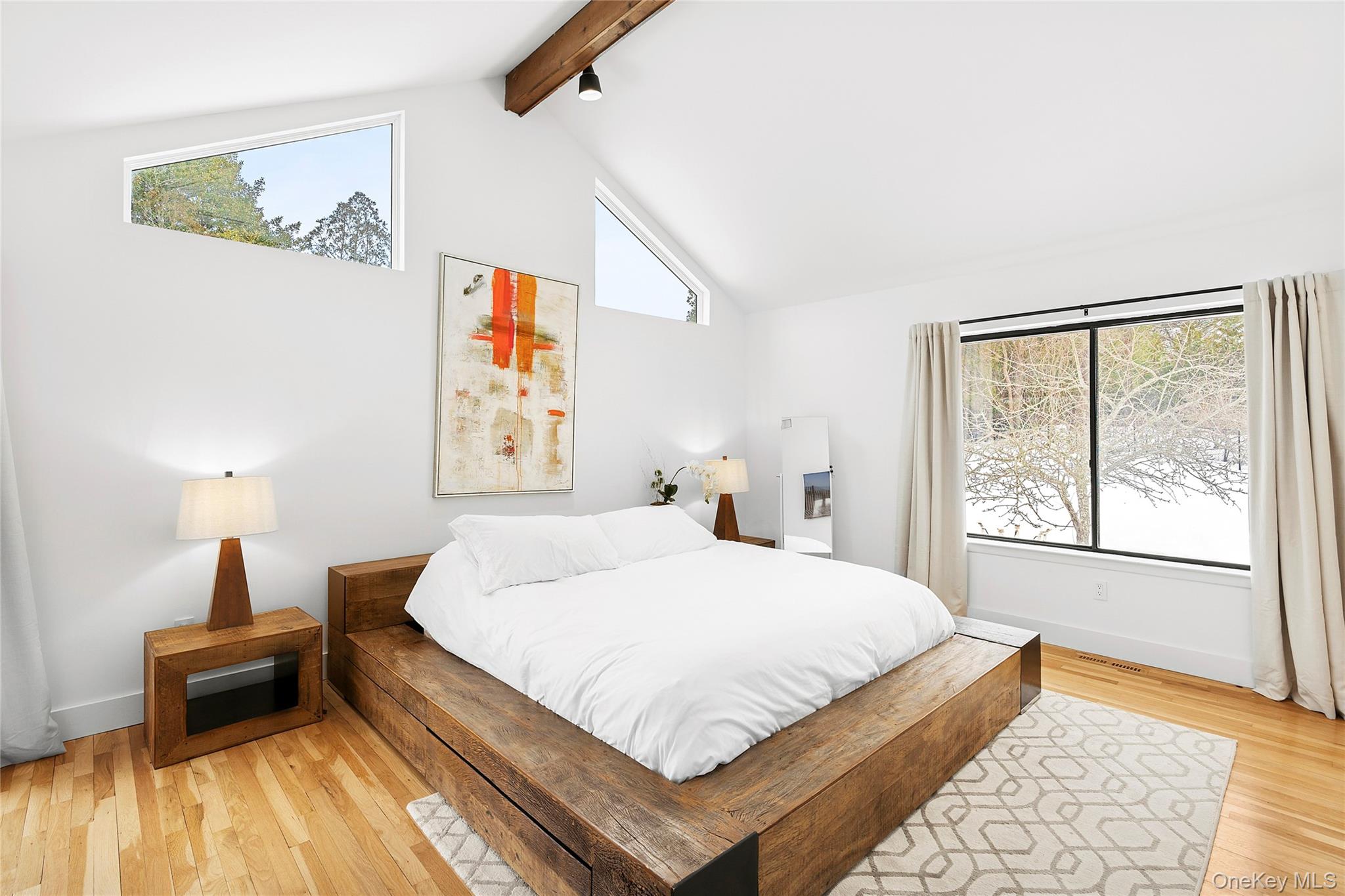 138 Longview Road Southampton, NY 11968 - Photo 5 of 13 a bedroom with a large bed and a window