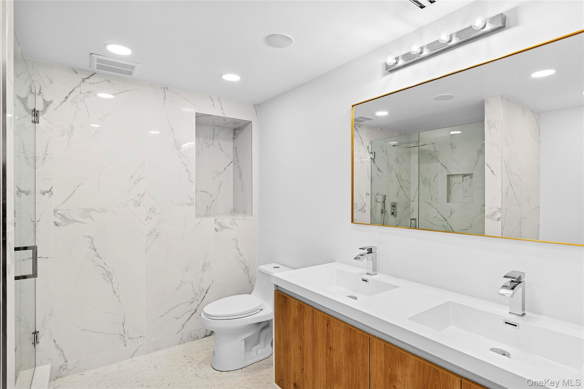 138 Longview Road Southampton, NY 11968 - Photo 8 of 13 a bathroom with a toilet sink and mirror