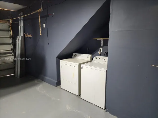 a bathroom with a double vanity sink and mirror