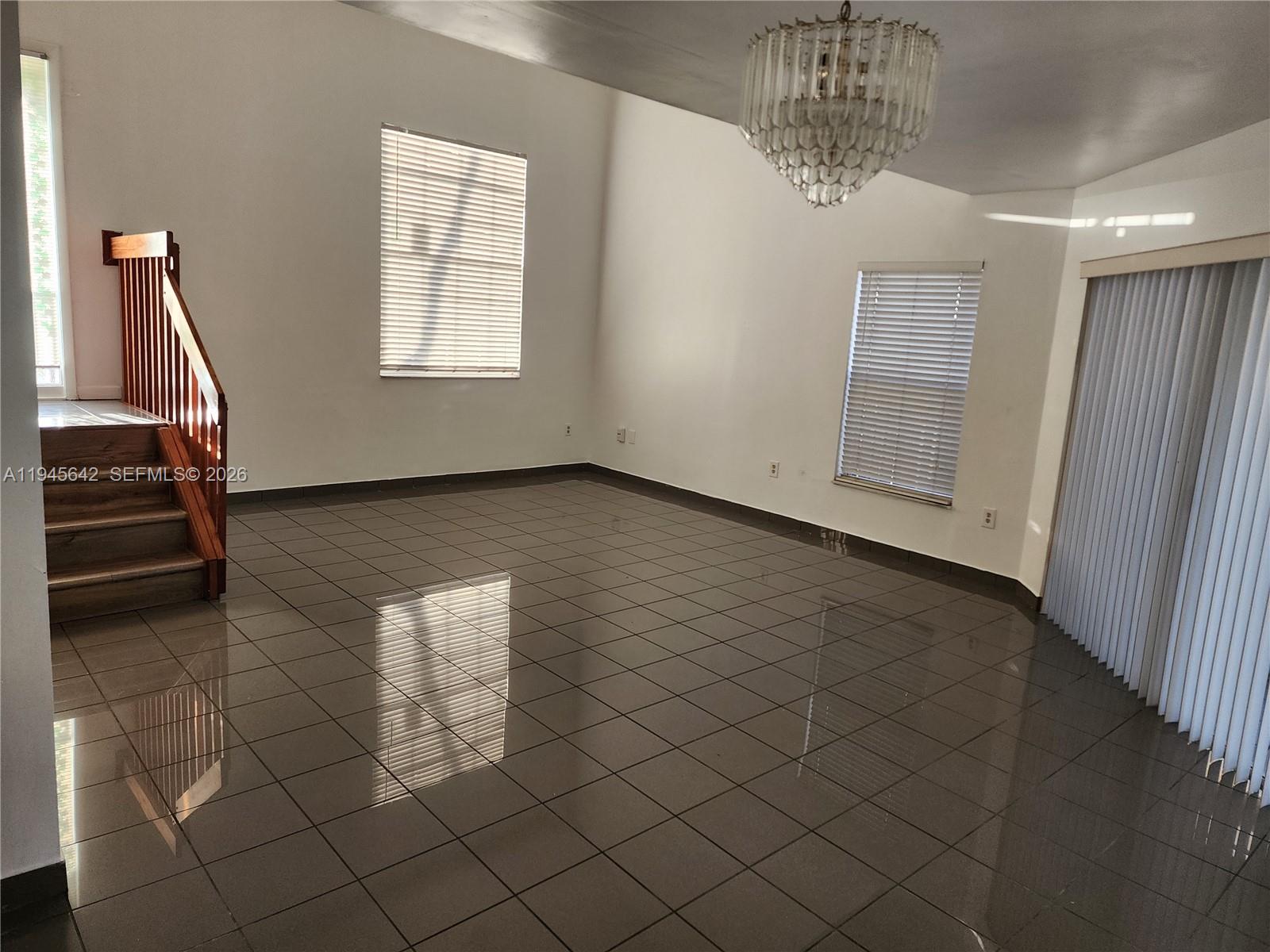 9863 Southwest 117th Place Miami, FL 33186 - Photo 13 of 29 a view of an empty room with a window