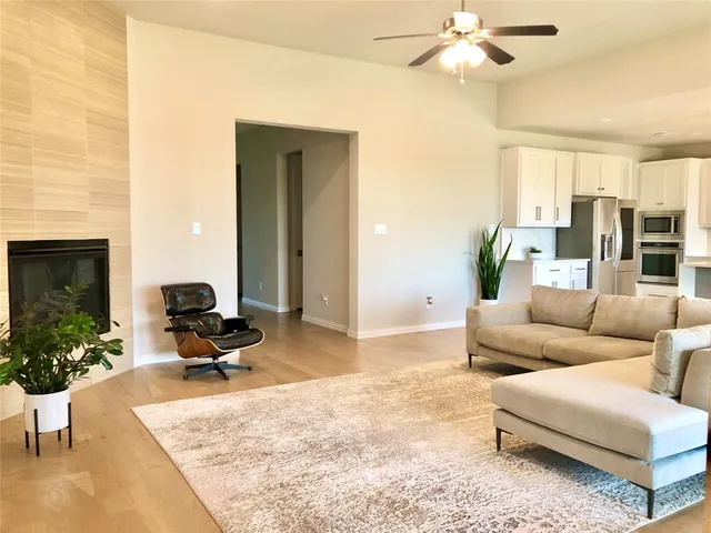 a living room with furniture and a fireplace