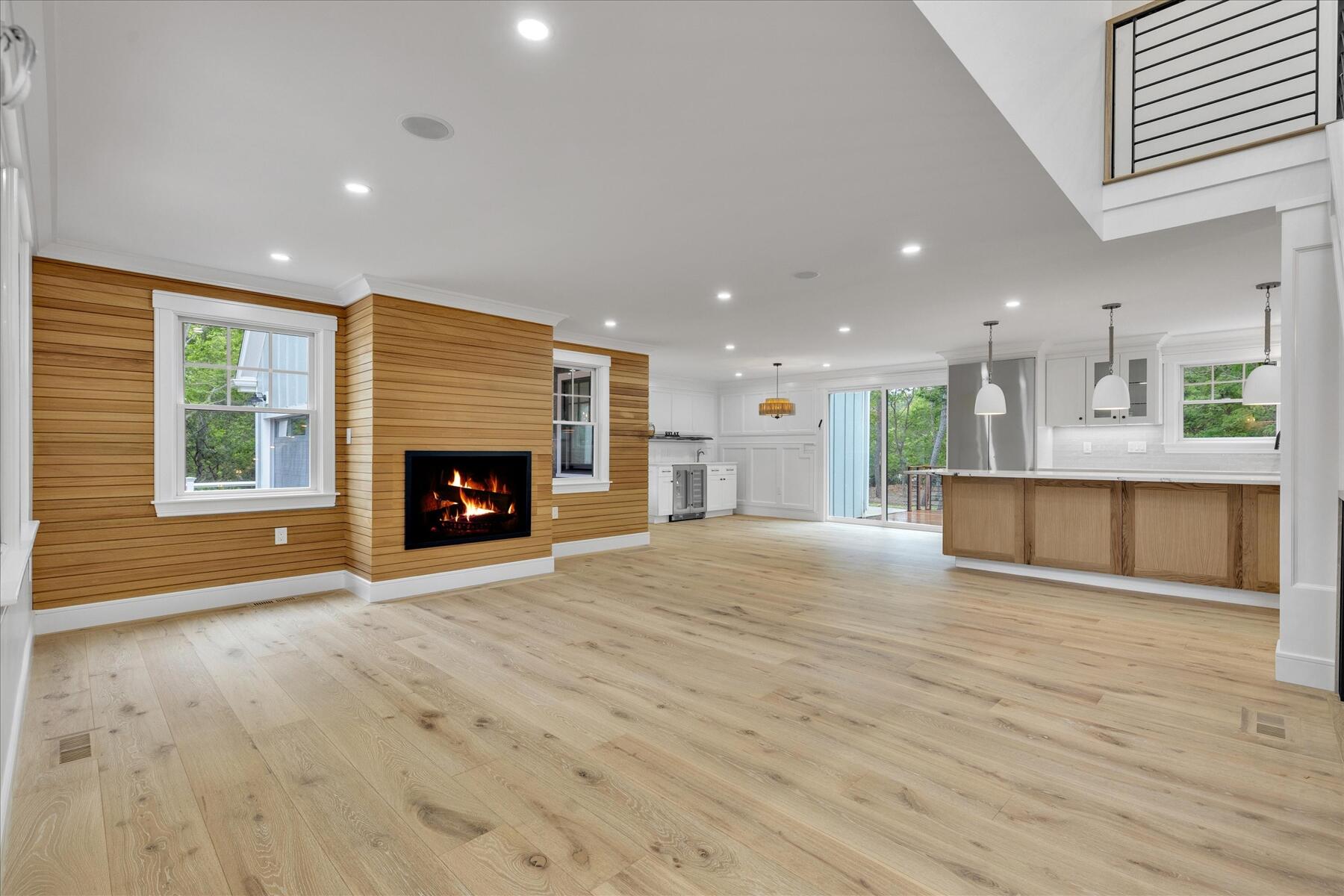 152 Pleasant Bay Road Harwich, MA 02645 - Photo 20 of 97 a view of an empty room with a fireplace and a window