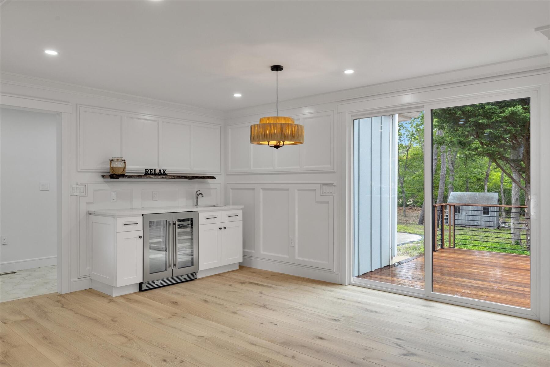 152 Pleasant Bay Road Harwich, MA 02645 - Photo 29 of 97 a kitchen with a stove a sink and a refrigerator