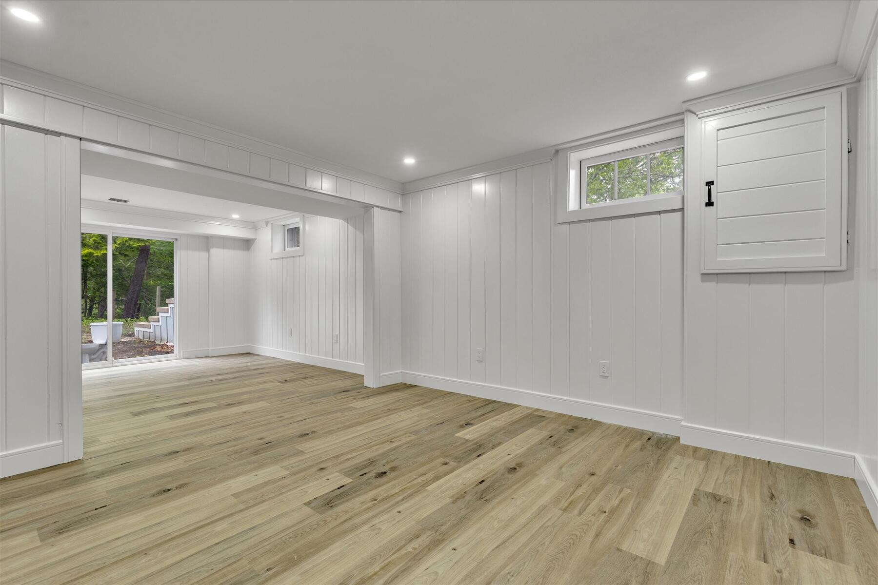 152 Pleasant Bay Road Harwich, MA 02645 - Photo 44 of 97 a view of an empty room with wooden floor and a window