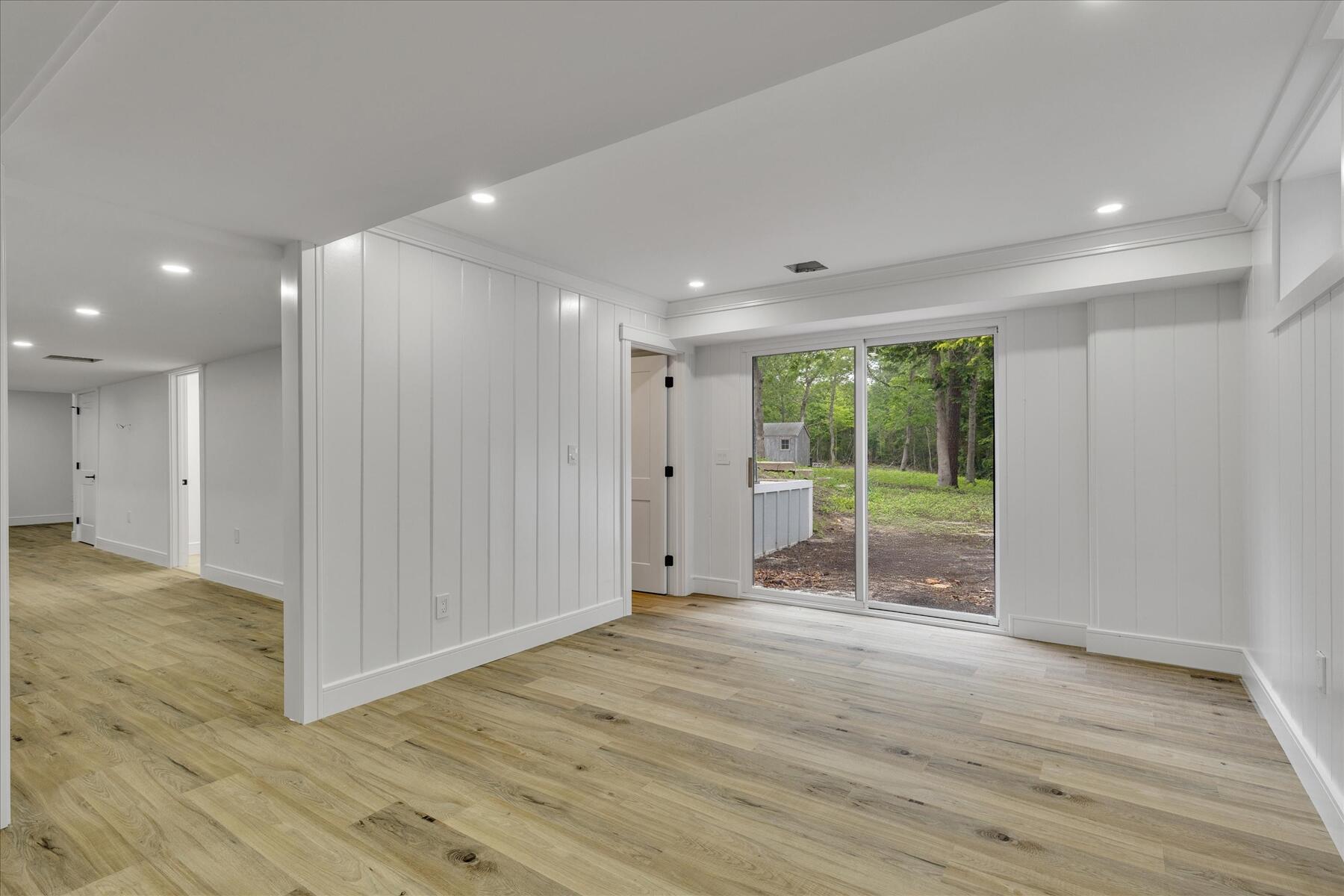 152 Pleasant Bay Road Harwich, MA 02645 - Photo 46 of 97 a view of empty room with wooden floor and fan
