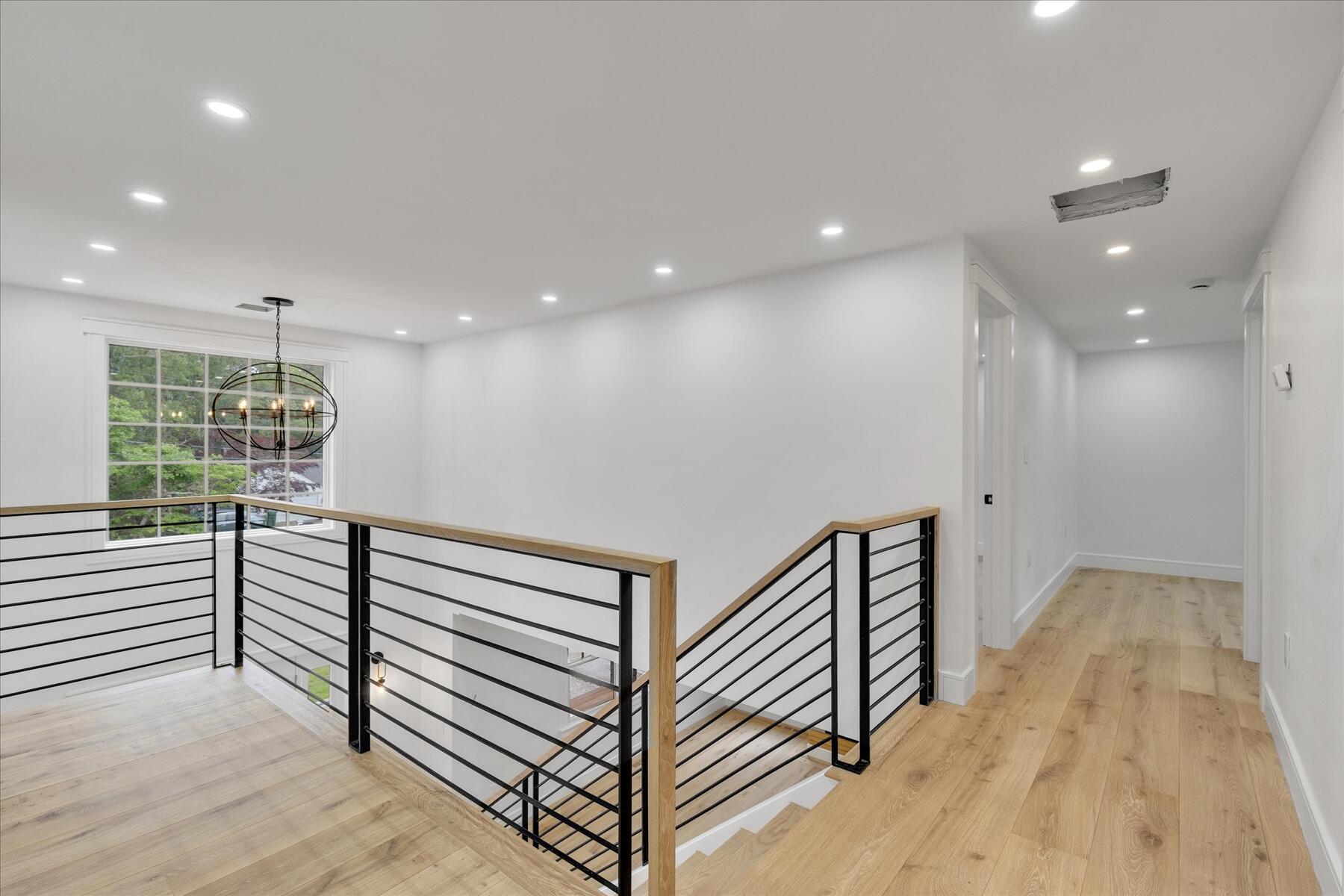 152 Pleasant Bay Road Harwich, MA 02645 - Photo 58 of 97 a view of a hallway with stairs and a window