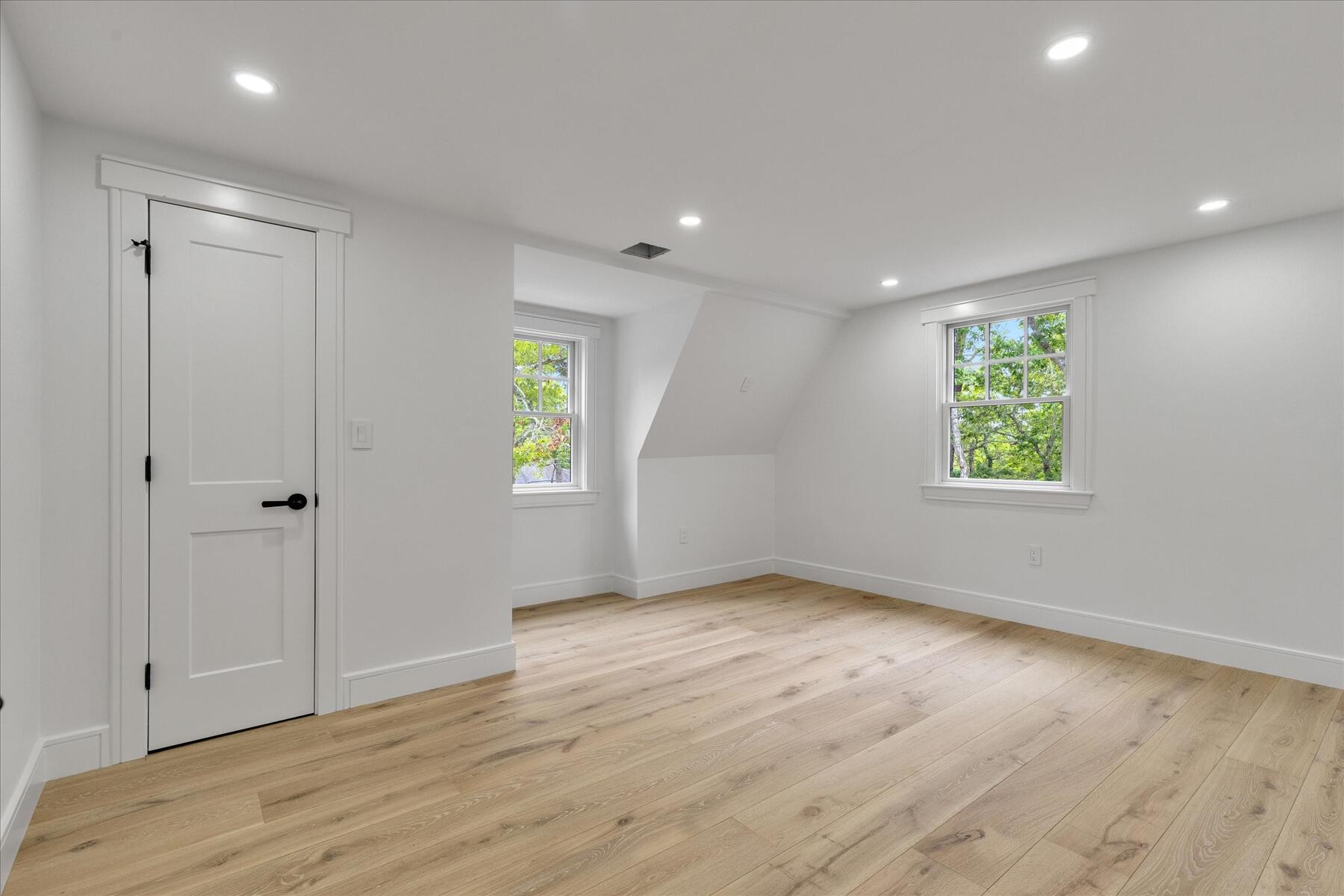 152 Pleasant Bay Road Harwich, MA 02645 - Photo 59 of 97 wooden floor in an empty room with a window