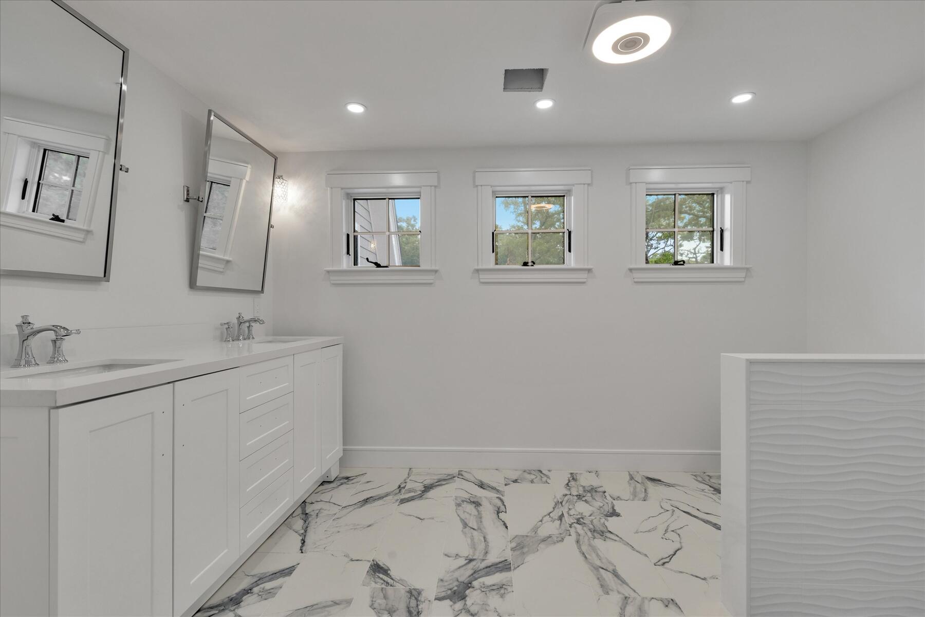 152 Pleasant Bay Road Harwich, MA 02645 - Photo 67 of 97 a bathroom with 2 sink and a mirror