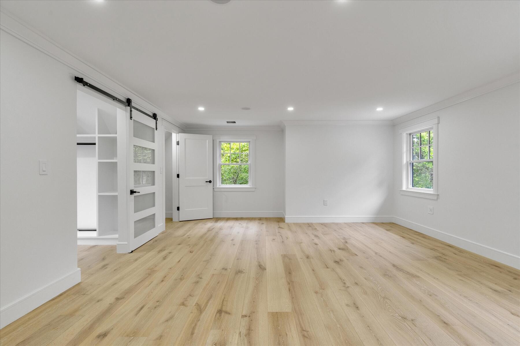 152 Pleasant Bay Road Harwich, MA 02645 - Photo 71 of 97 wooden floor in an empty room with a window