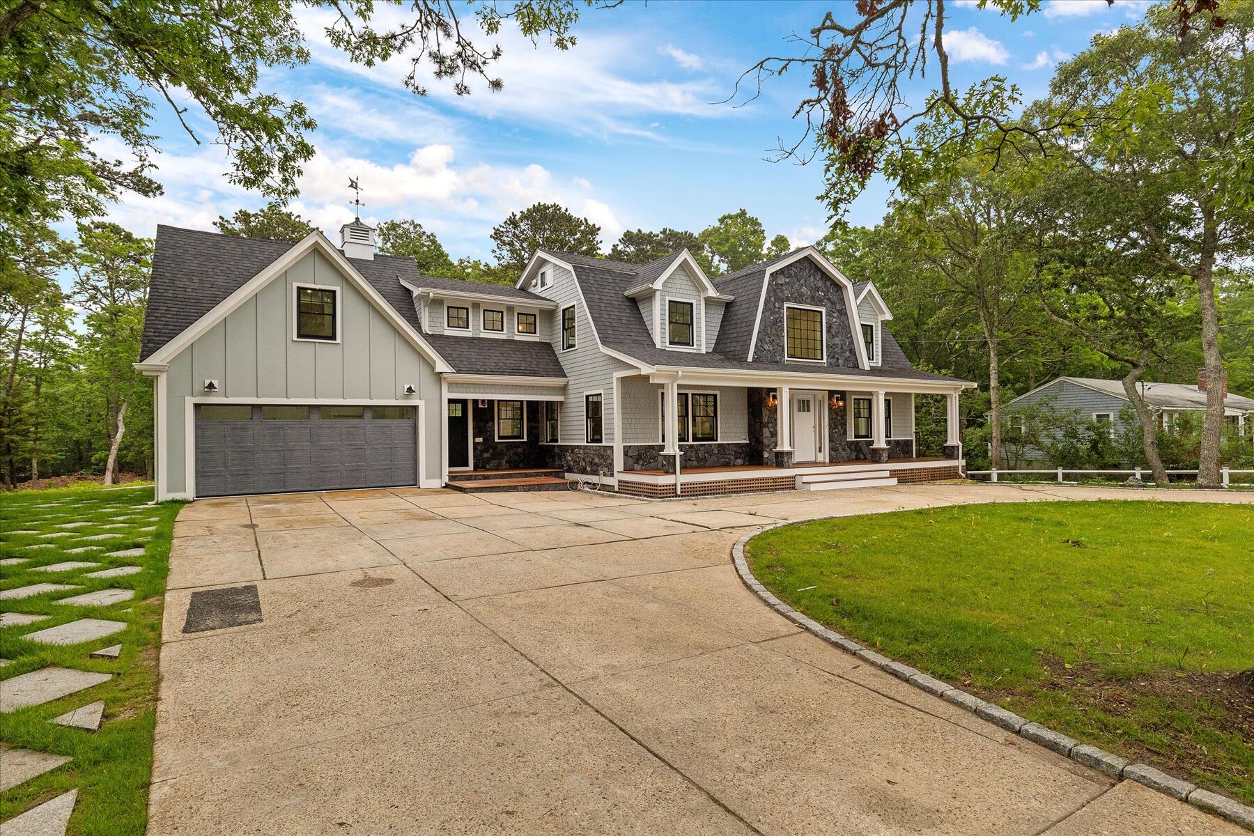152 Pleasant Bay Road Harwich, MA 02645 - Photo 77 of 97 a front view of a house with a garden and trees