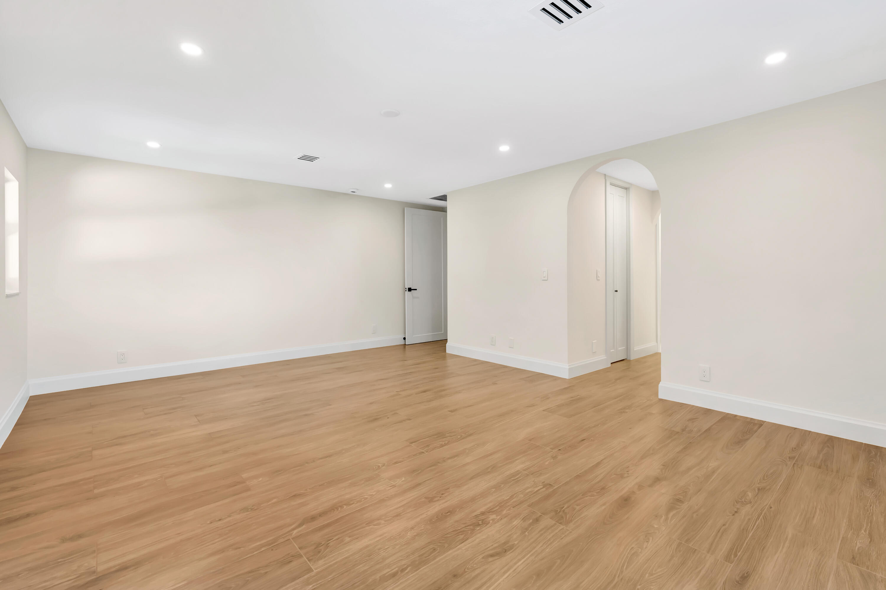 3984 Southeast Fairway East Stuart, FL 34997 - Photo 21 of 40 a view of an empty room with wooden floor
