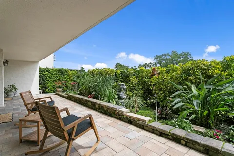 a view of a two chairs in the balcony