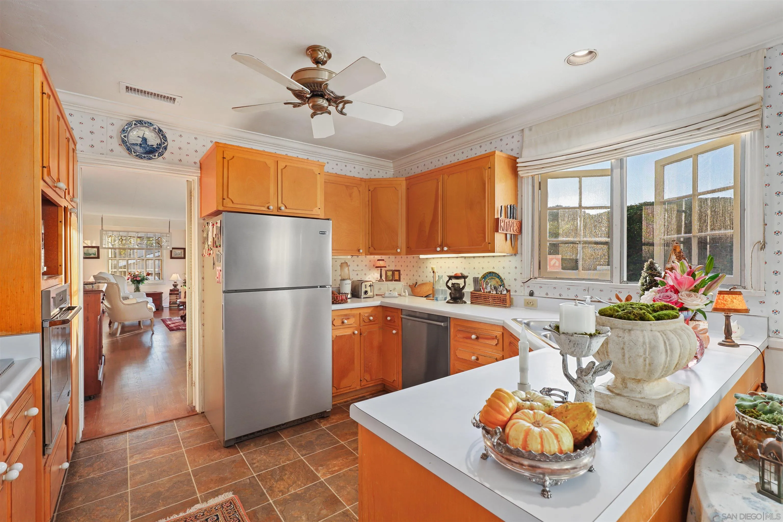 6029 Waverly Avenue La Jolla, CA 92037 - Photo 14 of 48 a kitchen with a refrigerator and a stove
