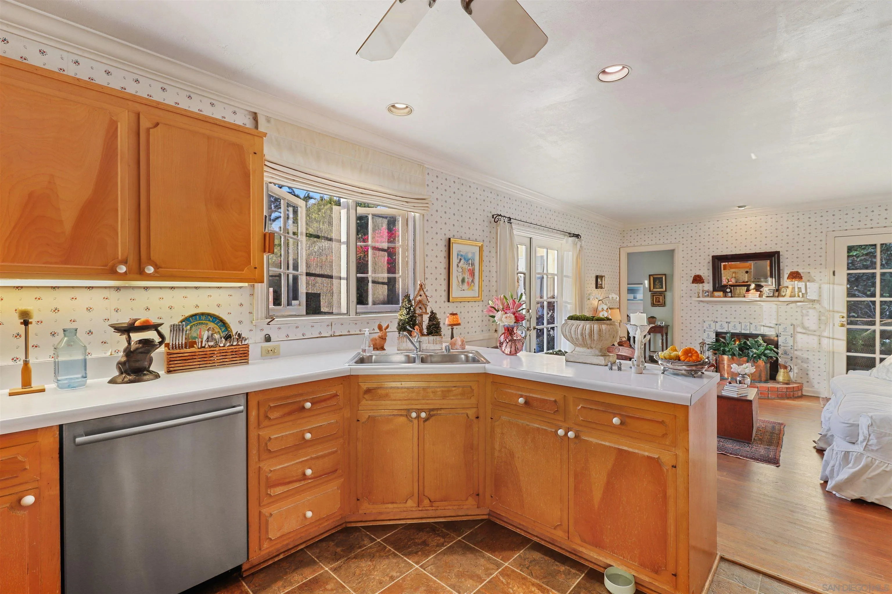 6029 Waverly Avenue La Jolla, CA 92037 - Photo 15 of 48 a kitchen with a sink stove and cabinets