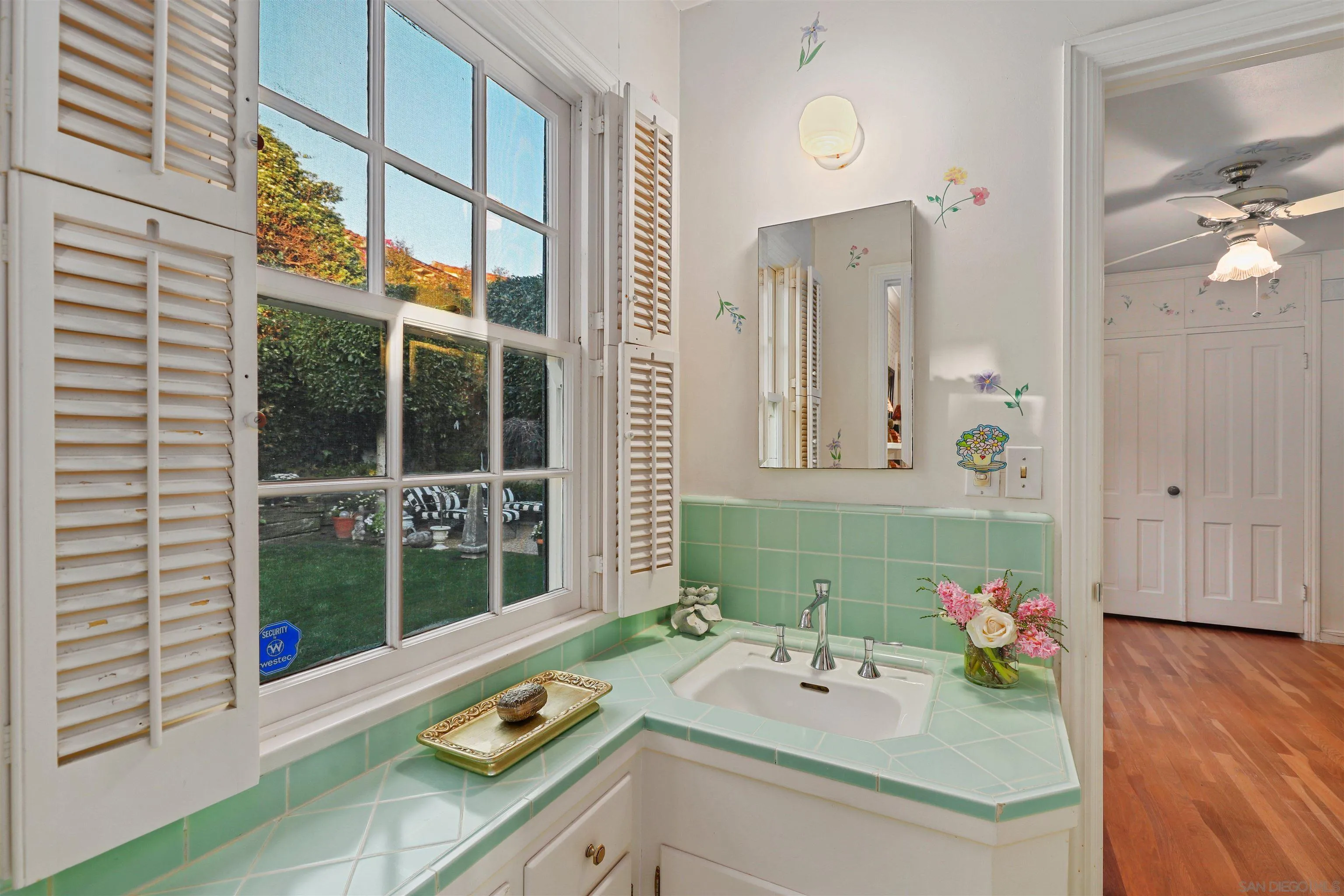 6029 Waverly Avenue La Jolla, CA 92037 - Photo 20 of 48 a bathroom with a sink vanity and a mirror