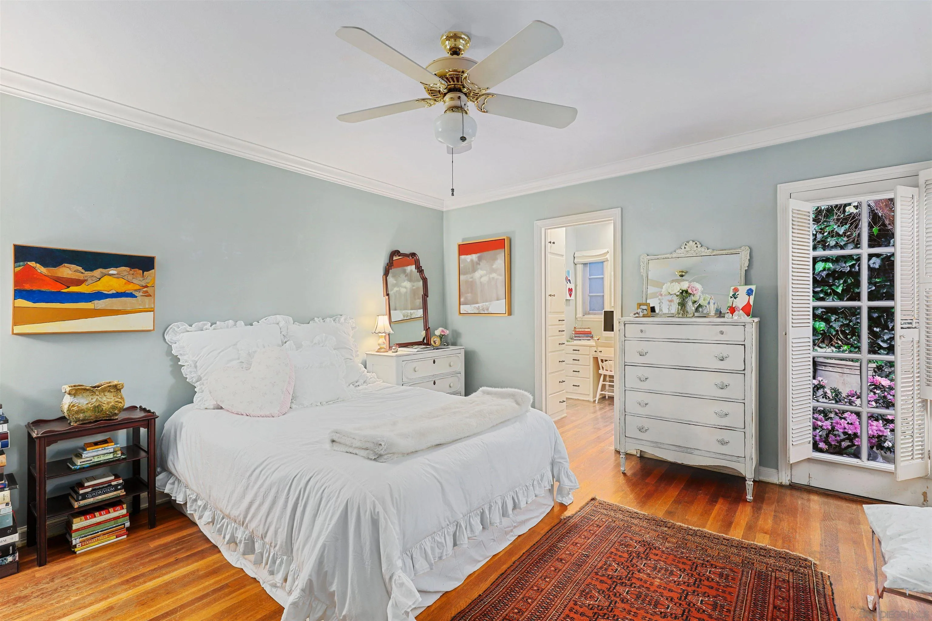 6029 Waverly Avenue La Jolla, CA 92037 - Photo 23 of 48 a bedroom with a bed and a chandelier