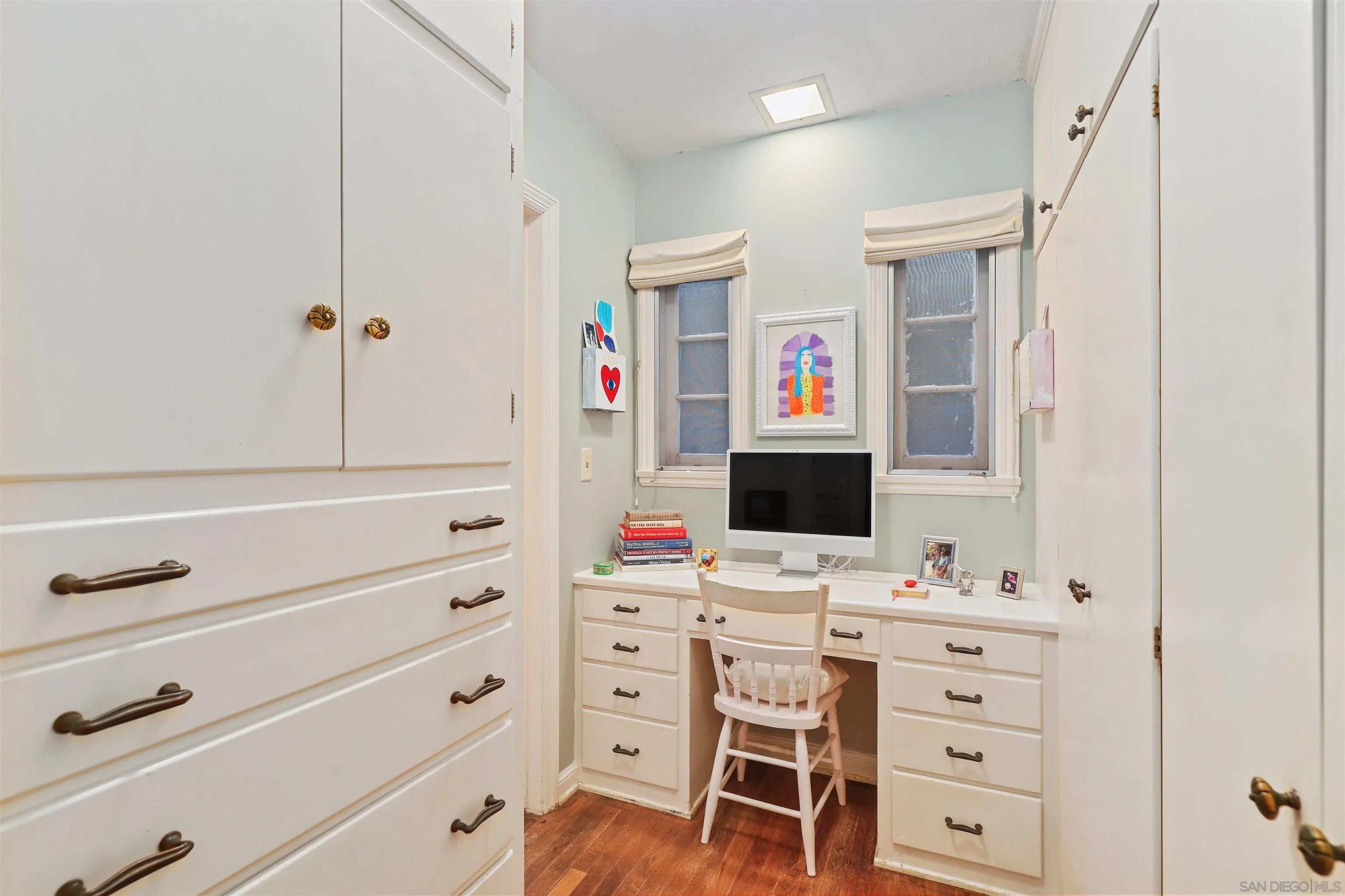 6029 Waverly Avenue La Jolla, CA 92037 - Photo 24 of 48 a bathroom with a sink vanity and a mirror