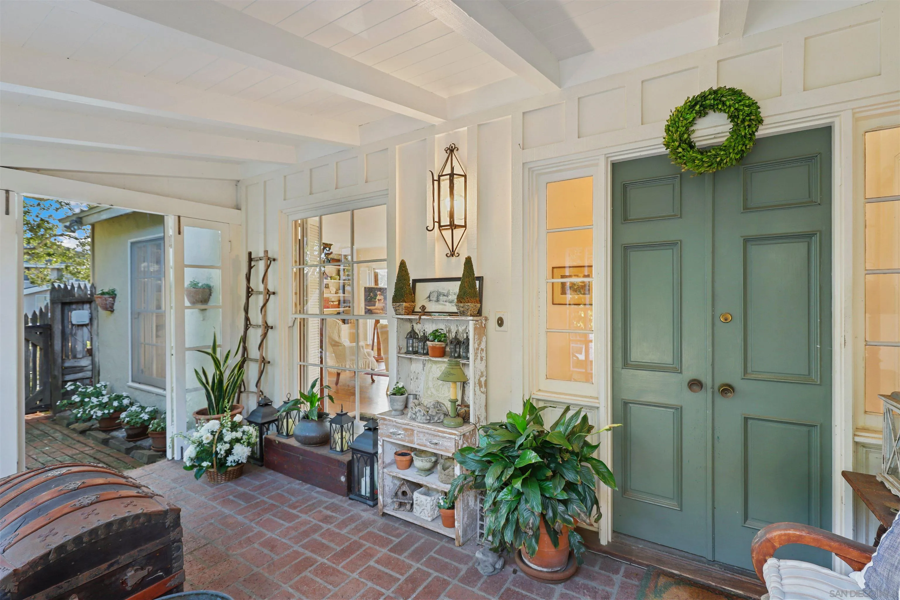 6029 Waverly Avenue La Jolla, CA 92037 - Photo 29 of 48 a living room filled with furniture and a chandelier