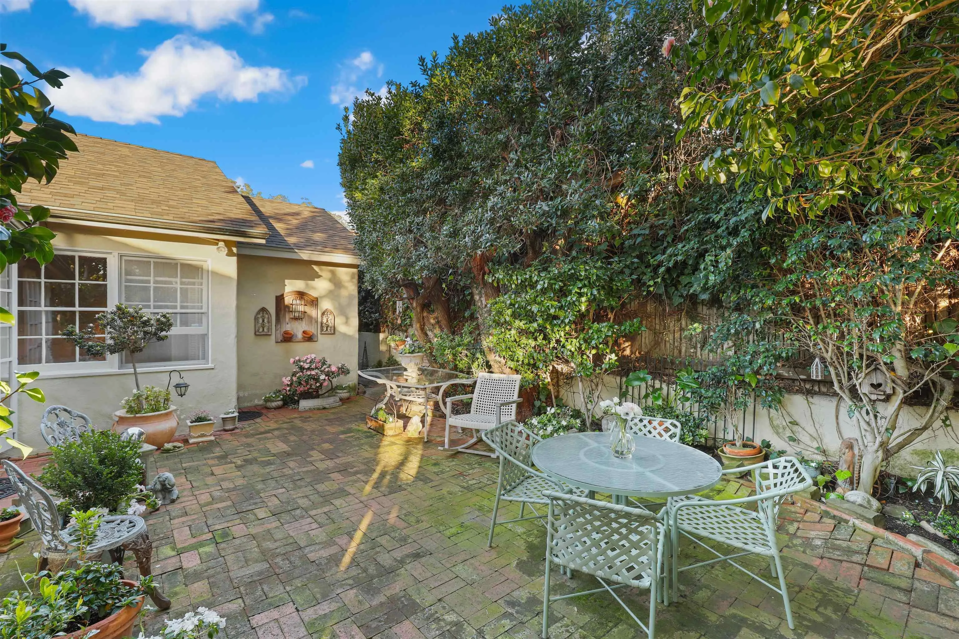 6029 Waverly Avenue La Jolla, CA 92037 - Photo 32 of 48 a view of a chair and table in backyard of the house