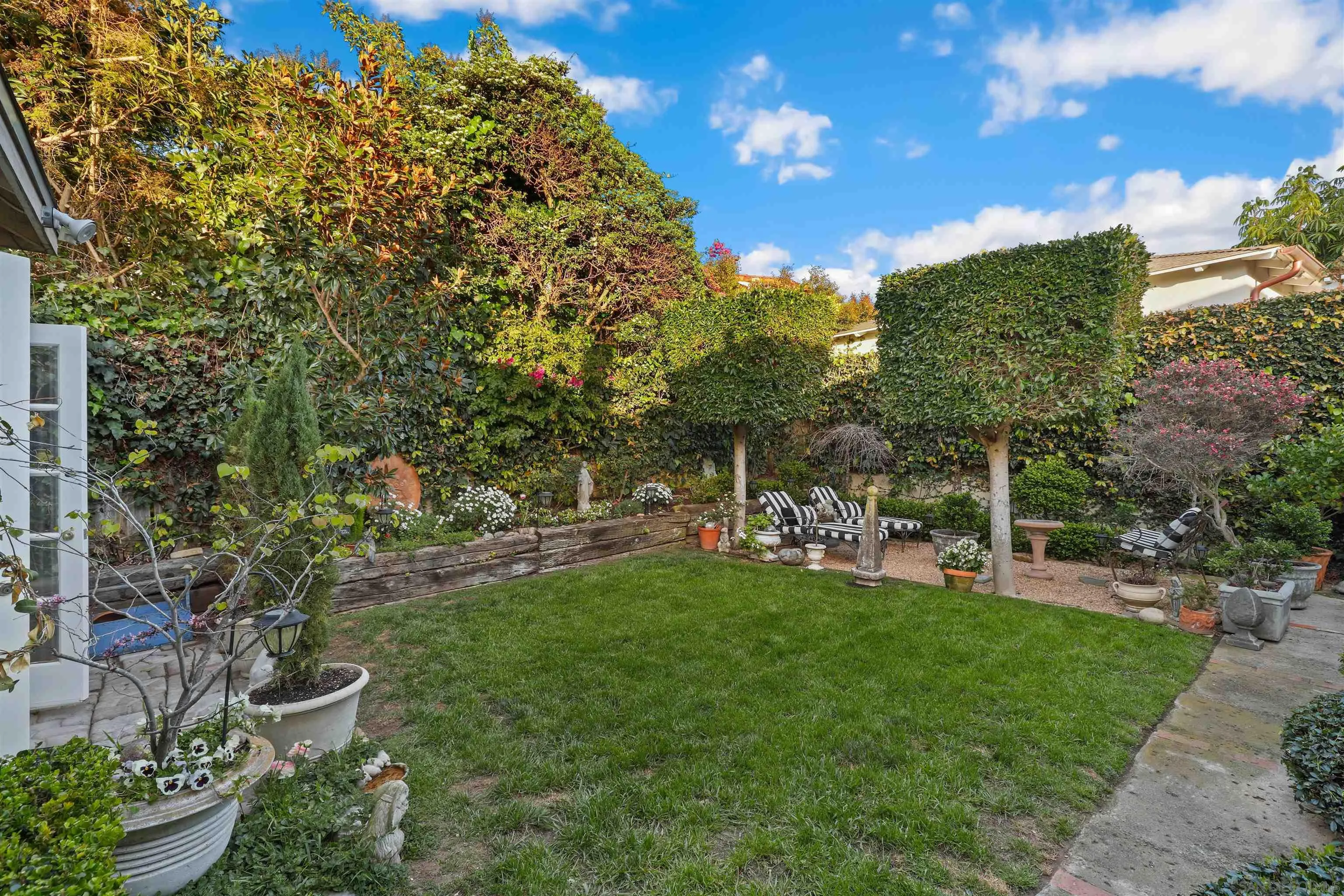 6029 Waverly Avenue La Jolla, CA 92037 - Photo 37 of 48 a view of a chair and table of the garden