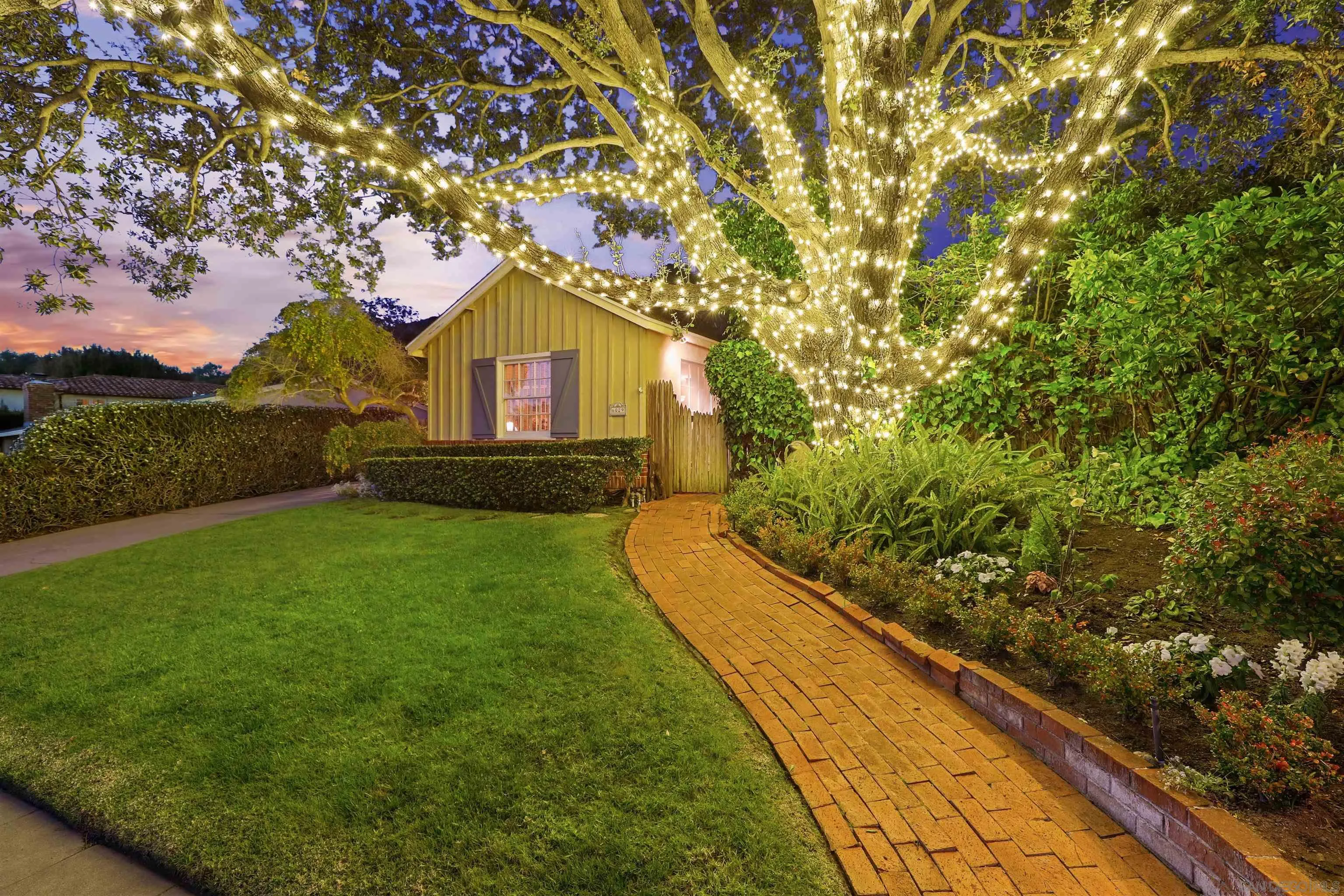 6029 Waverly Avenue La Jolla, CA 92037 - Photo 7 of 48 a front view of a house with garden