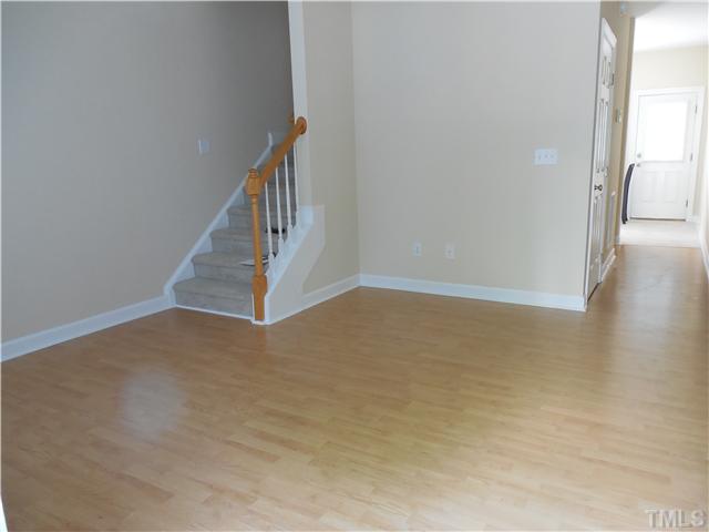 2604 Sterling Park Drive Raleigh, NC 27603 - Photo 2 of 10 a view of an empty room with wooden floor