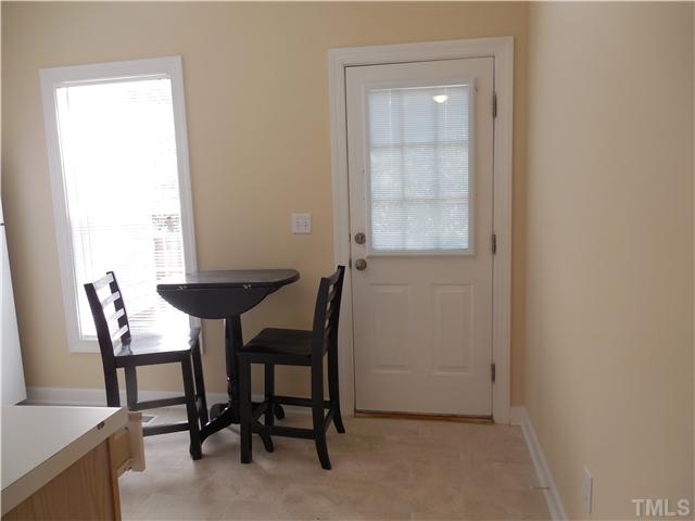 2604 Sterling Park Drive Raleigh, NC 27603 - Photo 3 of 10 a view of a dining room that has a table and chairs in it
