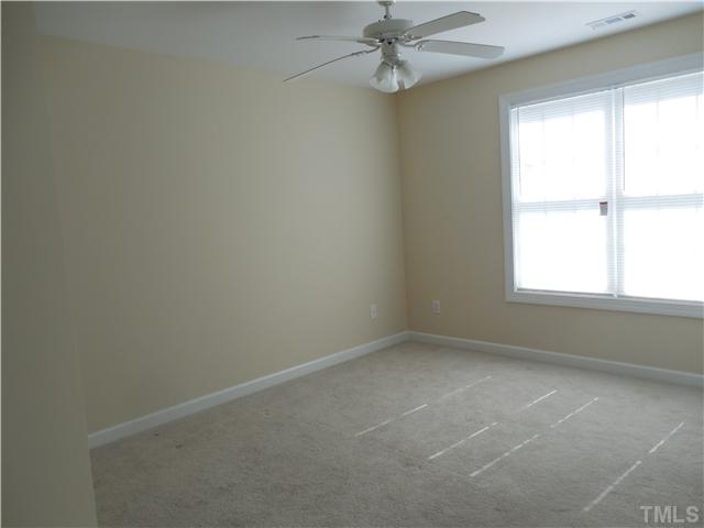 2604 Sterling Park Drive Raleigh, NC 27603 - Photo 5 of 10 an empty room with a window
