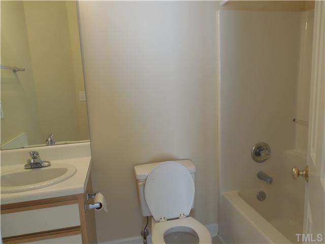 2604 Sterling Park Drive Raleigh, NC 27603 - Photo 6 of 10 a bathroom with a toilet and a sink