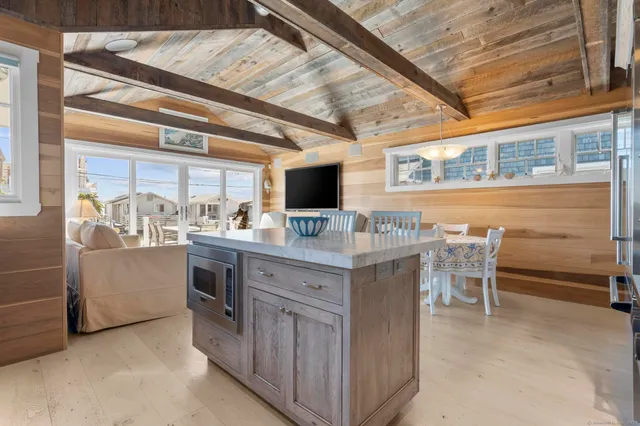 a view of kitchen with sink and breakfast area