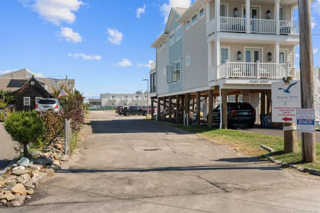 a view of ocean with a building in the background