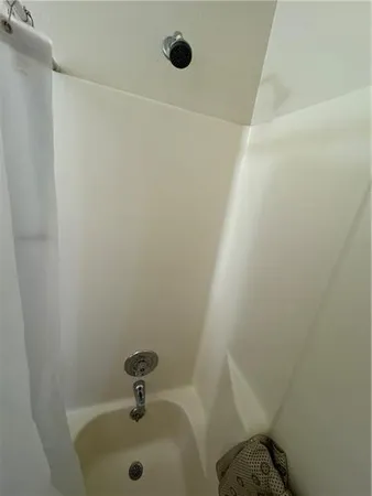 a bathroom with a sink and shower