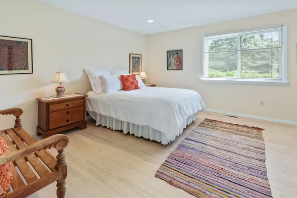 a bedroom with double bed and a window