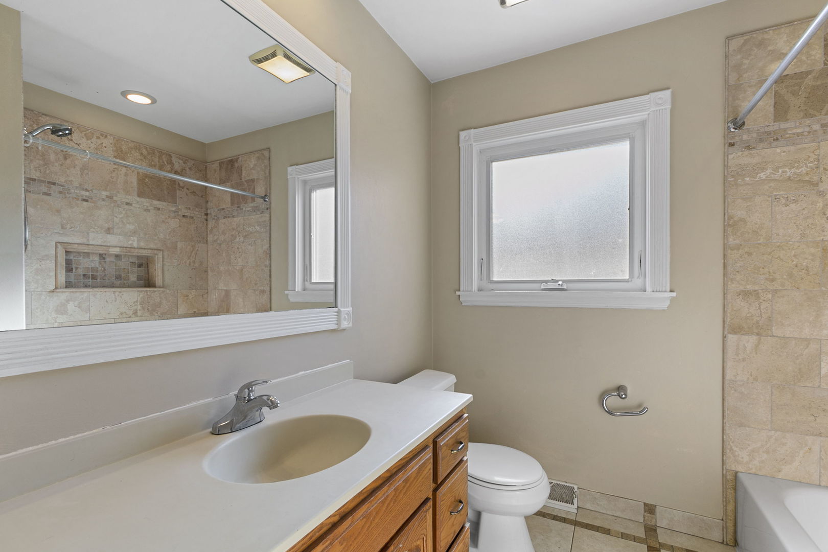8152 Mayfield Avenue Burbank, IL 60459 - Photo 16 of 21 a bathroom with a sink toilet and mirror