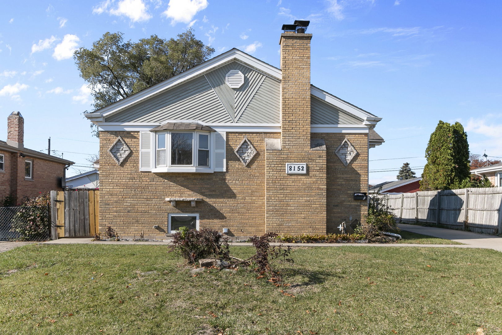 8152 Mayfield Avenue Burbank, IL 60459 - Photo 2 of 21 a front view of a house with a yard