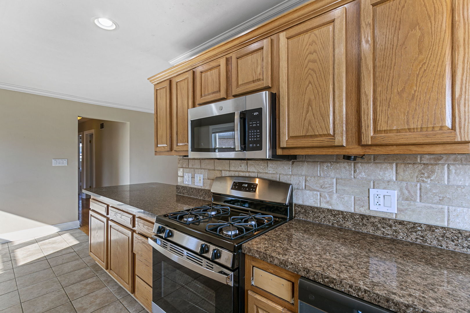 8152 Mayfield Avenue Burbank, IL 60459 - Photo 8 of 21 a kitchen with granite countertop cabinets stainless steel appliances and a sink