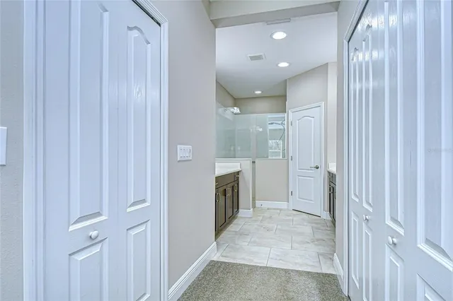 a bathroom with a sink double vanity and a mirror