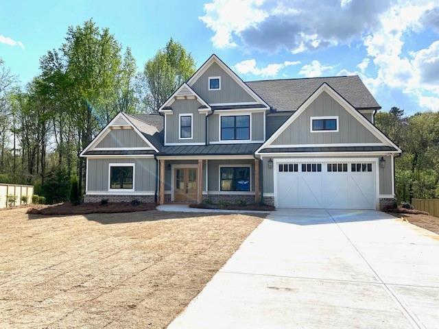 461 Spring Creek Drive Monroe, GA 30655 - Photo 2 of 3 a front view of a house with a yard