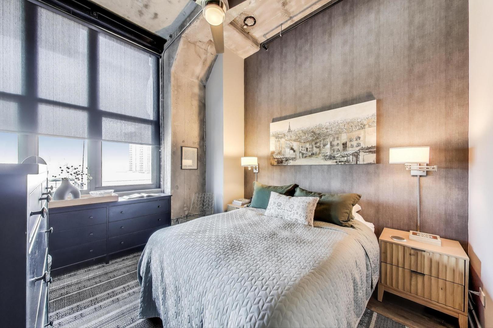 320 East 21st Street, Unit 501 Chicago, IL 60616 - Photo 7 of 22 a bedroom with a bed and a window