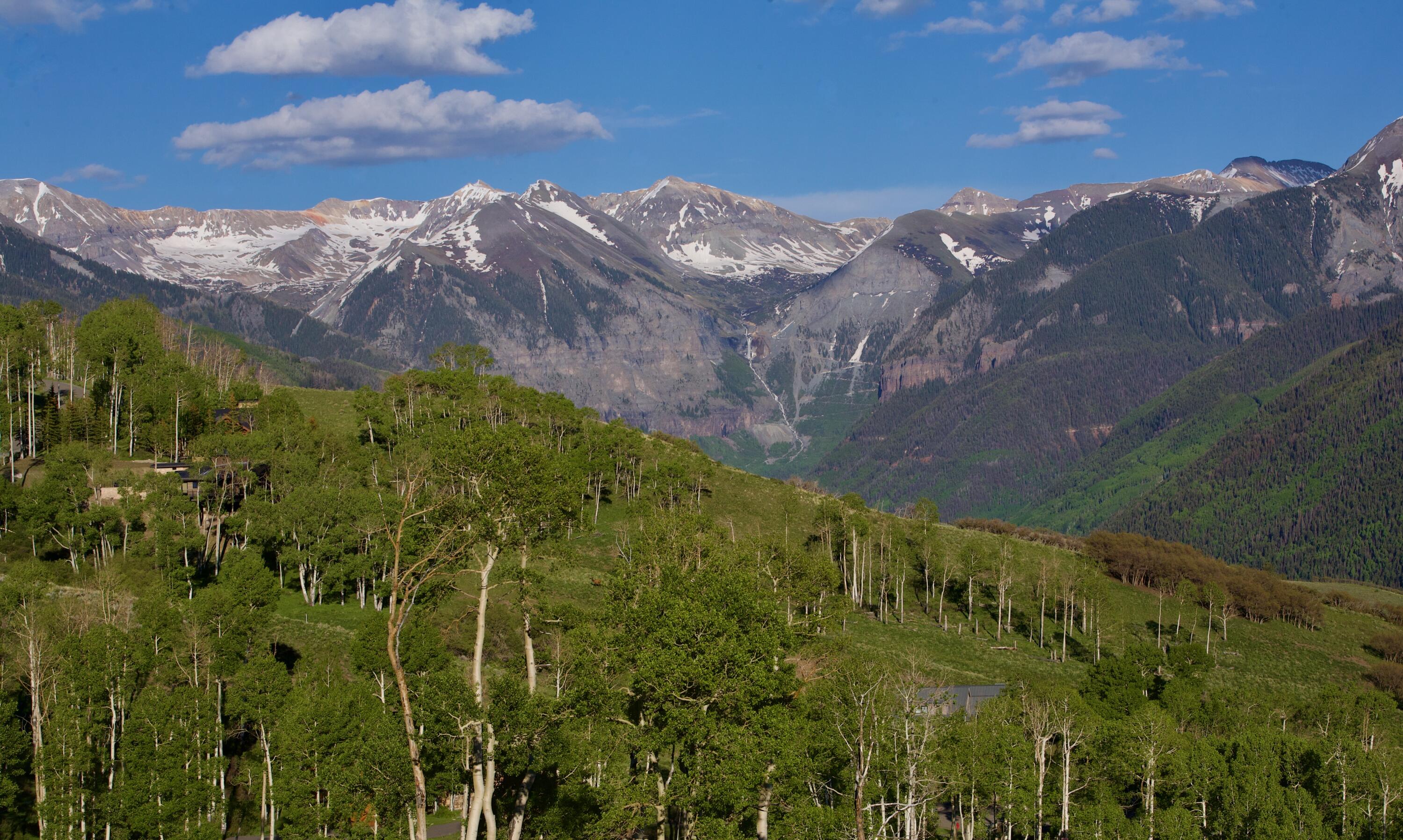 Lot 126 Aldasoro Ranch Telluride, CO 81435 - Photo 8 of 17 a view of a yard with a house in the background