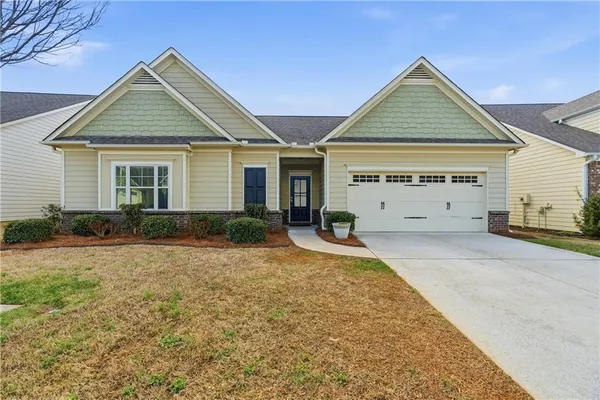front view of a house with a yard