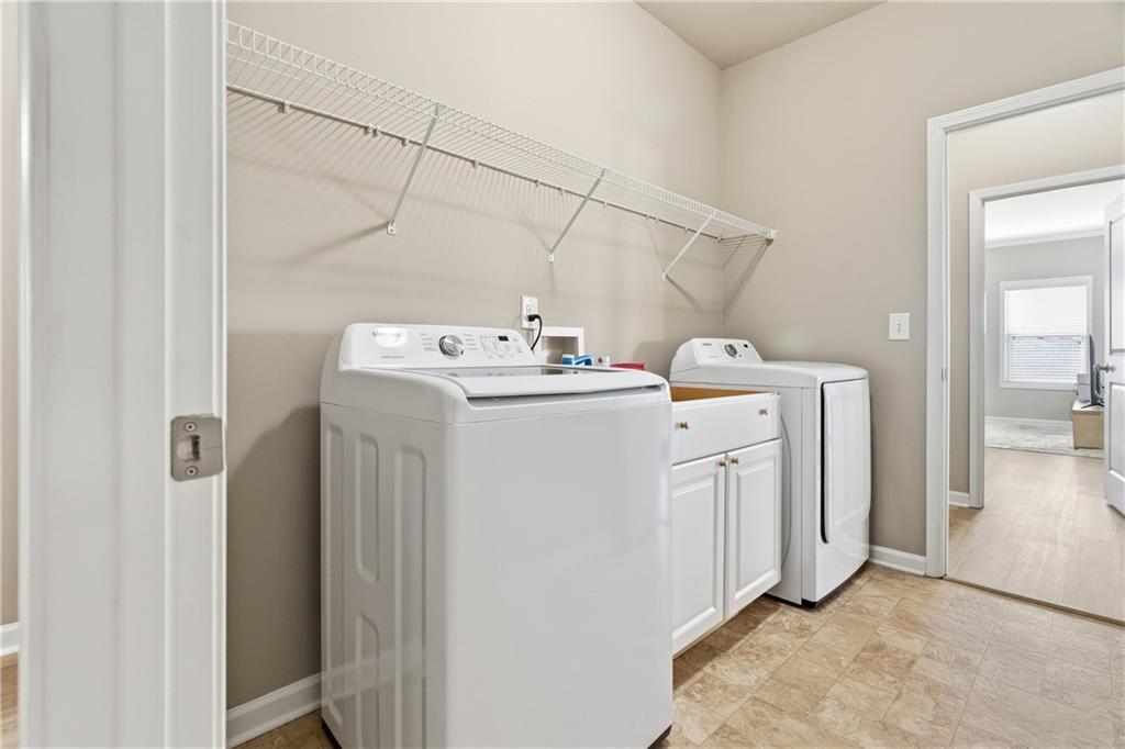 4479 Clubside Drive Gainesville, GA 30504 - Photo 12 of 47 a utility room with dryer and washer