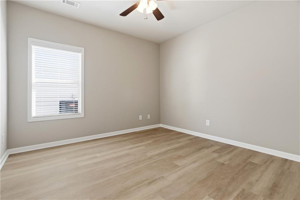 4479 Clubside Drive Gainesville, GA 30504 - Photo 13 of 47 an empty room with a window and a ceiling fan
