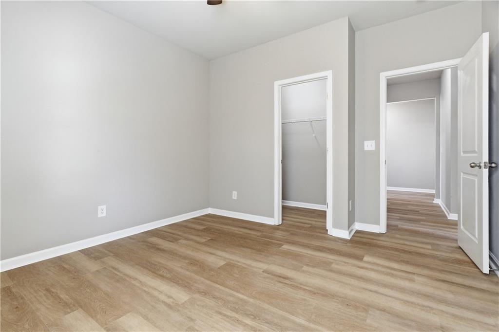 4479 Clubside Drive Gainesville, GA 30504 - Photo 14 of 47 an empty room with wooden floor & closet area