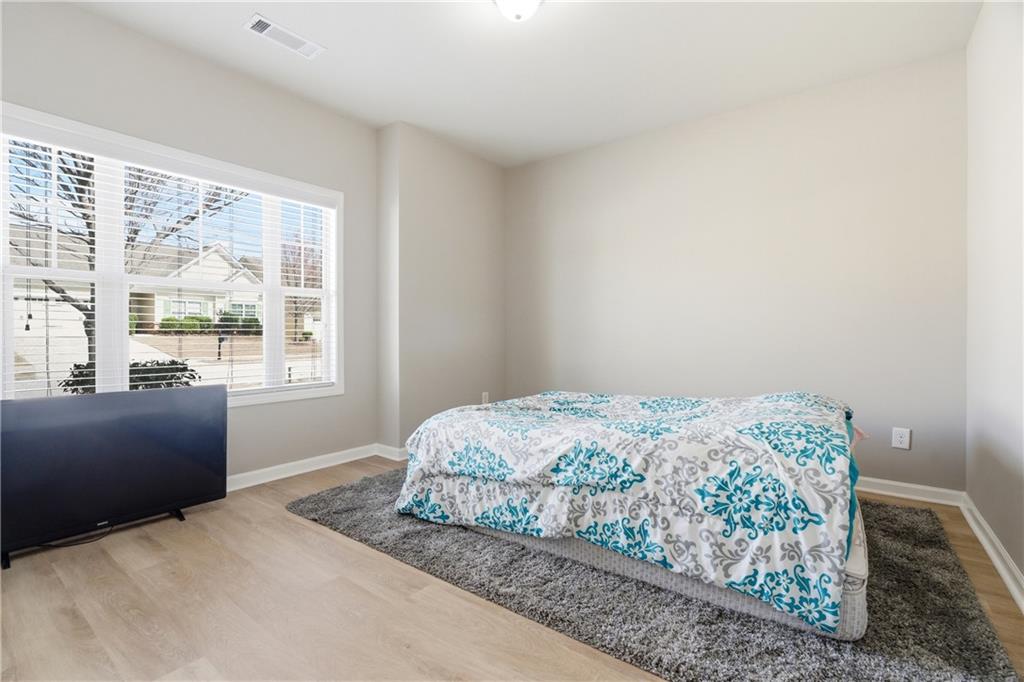 4479 Clubside Drive Gainesville, GA 30504 - Photo 15 of 47 a bedroom with a bed and a window