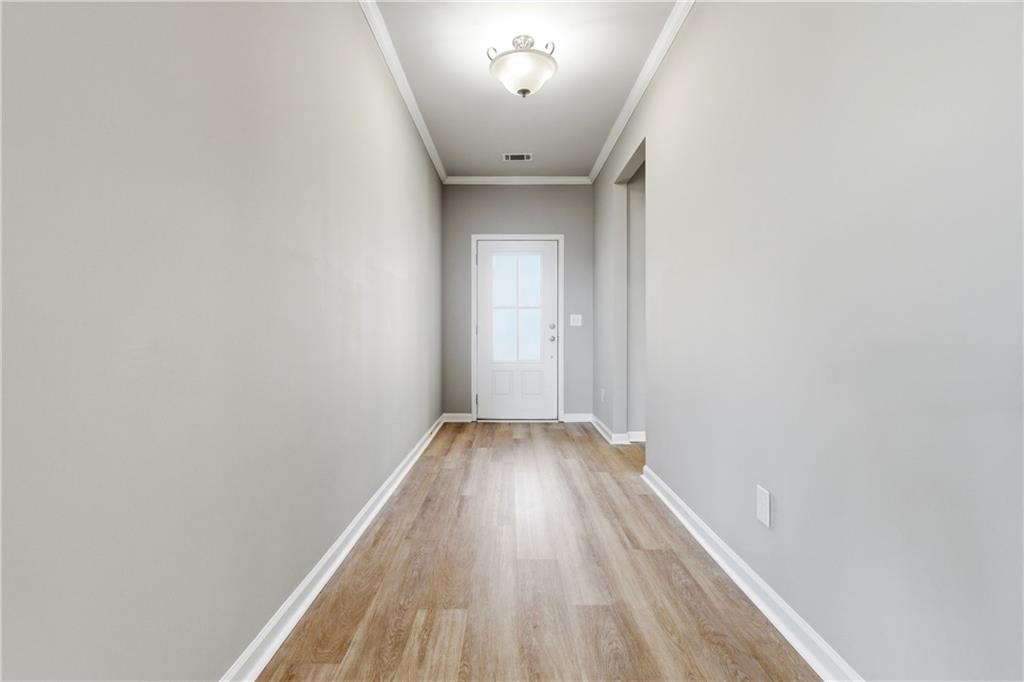 4479 Clubside Drive Gainesville, GA 30504 - Photo 17 of 47 a view of a hallway with wooden floor